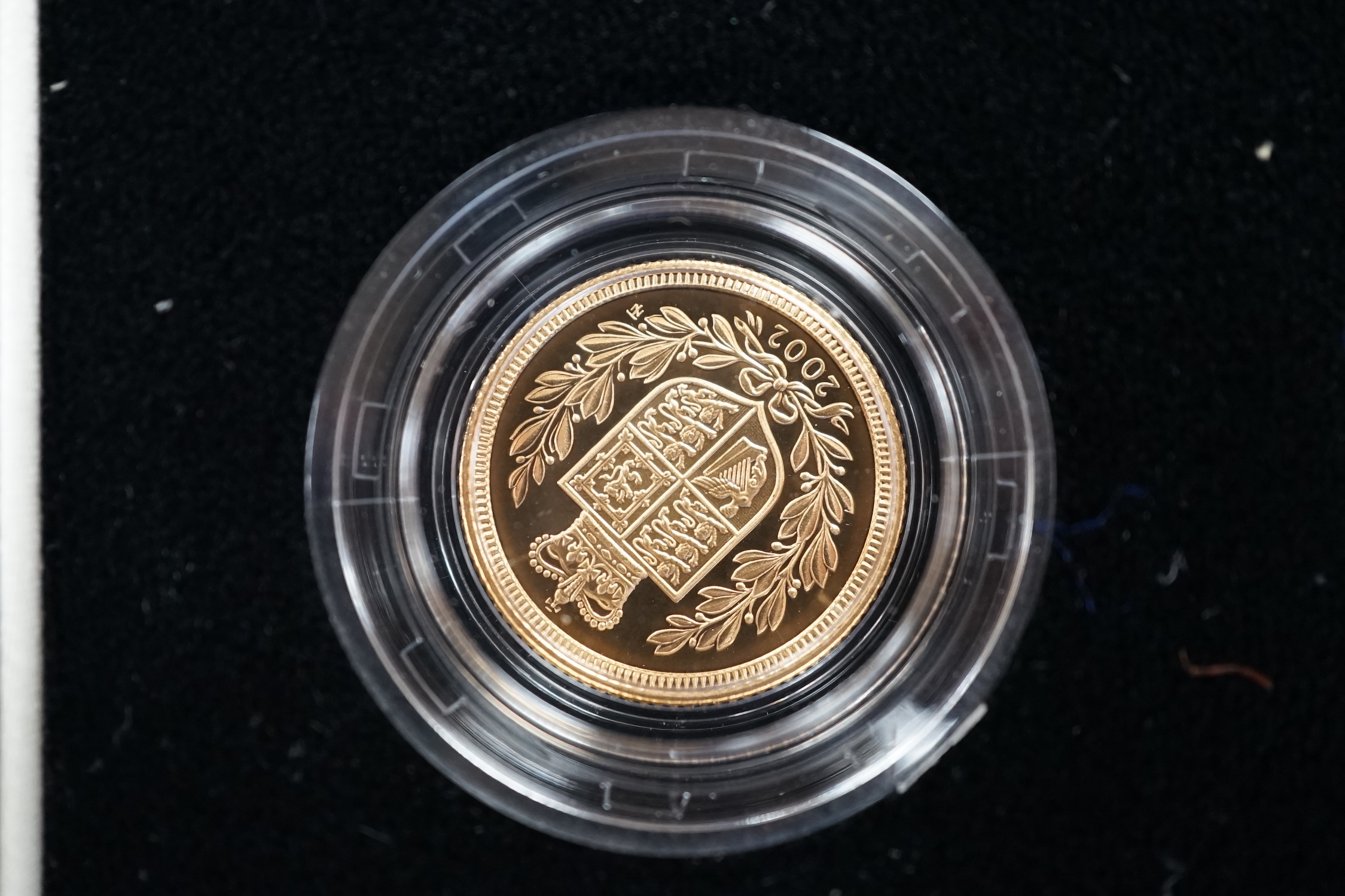 A cased 2002 United Kingdom gold proof sovereign three coin collection, with certificate.